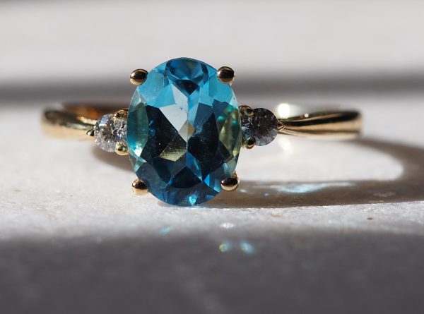 Danielle 2.25ct Swiss Blue Topaz Oval & Moissanite Three Stone Ring in 10K solid Yellow Gold